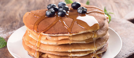 Pancakes with blueberries. Breakfast concept. Top view. Panorama.の写真素材