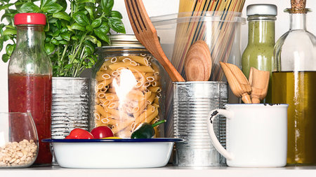 Kitchen pantry with Italian food products - pasta, olive oil, sauces.. Healthy food concept.