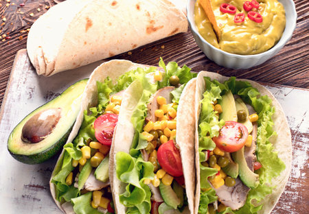 Authentic mexican tacos on a wooden background. Healthy food concept. Mexican food. Top view.の写真素材