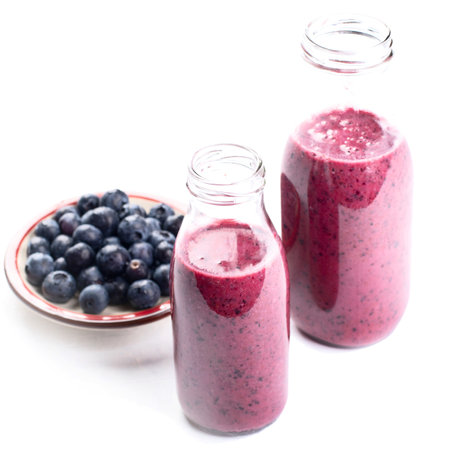 Bottles of smoothie from berries on a white background. Top view.の写真素材
