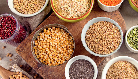 Raw healthy grain food on a gray background. Top view. Healthy eating concept. Panorama.の写真素材