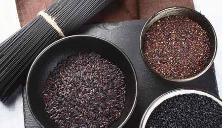 Black food. Dark cooking background. Top view. Panorama.の写真素材