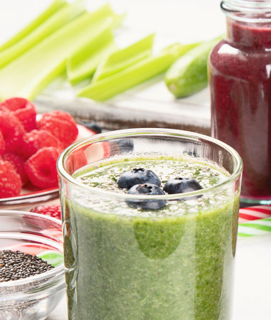 Fresh fruit and vegetables smoothies in glass bottles. Healthy diet and detox concept. Top view.の写真素材