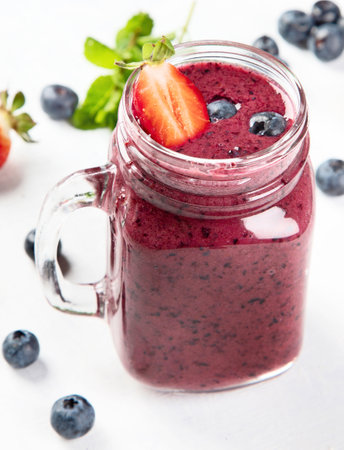Bottle of smoothie from berries on a white background. Top view.の写真素材