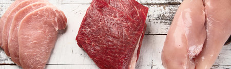 Meat on a gray background. Protein food. Healthy eating and diet concept. Top view.の写真素材