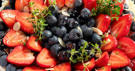 Delicious tart with fresh strawberries and blackberries on a gray background. Top view. Panorama.の写真素材