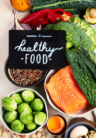 Various brain food products: fish, meat, nuts, vegetables and greens. Healthy food on a light background. Top view.の写真素材