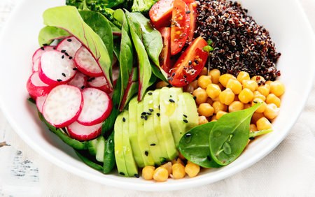 Healthy vegan lunch.Salad with quinoa, broccoli, tomatoes and chickpeaの写真素材