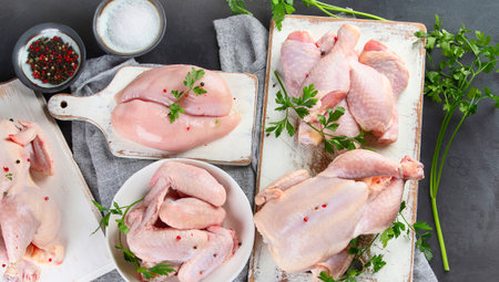 Different types of raw chicken meat on black background. Healthy diet eating.Top view. Panorama,の写真素材