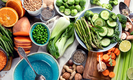 Fresh healthy vegan and vegetarian food on gray background. Diet, detox, clean eating concept. Top viewの写真素材