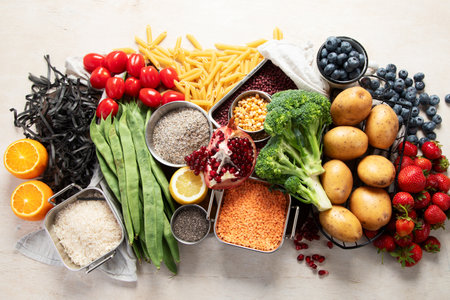 Healthy low carbs products. Keto diet concept. Vegetables, nuts, seeds, berries, cheese on a white background, top view.の写真素材