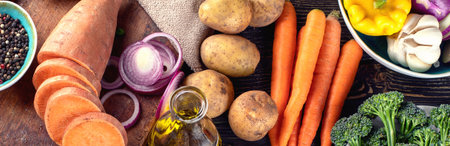 Fresh ingredients for healthy cooking on rustic wooden background. Vegan, vegetarian or diet food concept. Top view, panorama, bannerの写真素材