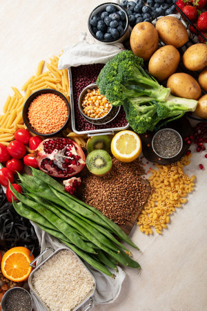 Ketogenic diet food. Healthy low carbs products. Keto diet concept. Vegetables, fish, meat, nuts, seeds, berries, cheese on a white background, top view.の写真素材