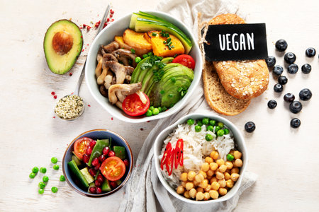 Healthy vegetarian and vegan salad and Buddha Bowls with vitamins, antioxidants, protein on light background. Top view.の写真素材