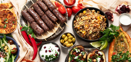 Delicious meat kebab with fresh vegetable salad served with variety of Turkish dishes and...