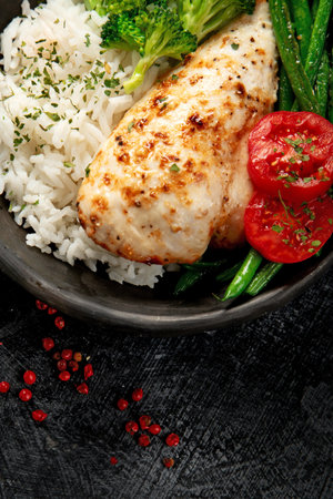 Healthy Homemade Chicken Breast and Rice with Broccoli on a light background. Top view.の写真素材