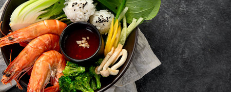 Shrimps with rice and vegetables on a dark background. Thai dish. Asian Food. Top view.の写真素材