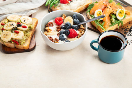 Variety of sandwiches with different toppings for breakfast on a board. Top view. Vegetarian food.