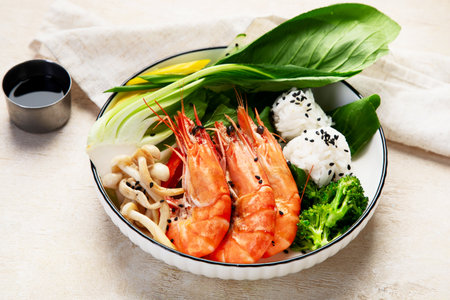 Shrimps with rice and vegetables on a light background. Thai dish. Asian Food. Top view.の写真素材