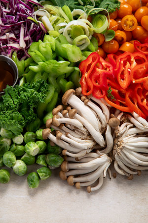 Sliced and chopped colorful fresh vegetables food preparation on a light background. Top view. Copy space.の写真素材