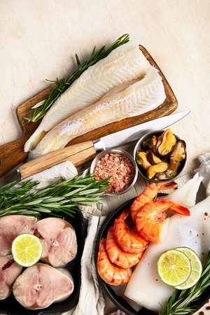 Variety of fresh seafood and herbs. Fresh fish and seafood arrangement. Top view.の写真素材