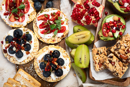 Healthy Snack Platter with fruits, nuts and dried fruits. Gourmet organic food, clean eating, plant-based protein, vegan diet. Top view.の写真素材