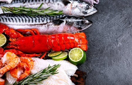 Variety of fresh seafood and herbs. Fresh fish and seafood arrangement. Top view.