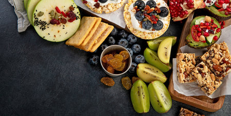 Healthy Snack Platter with fruits, nuts and dried fruits. Gourmet organic food, clean eating,...