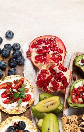 Healthy Snack Platter with fruits, nuts and dried fruits. Gourmet organic food, clean eating,...