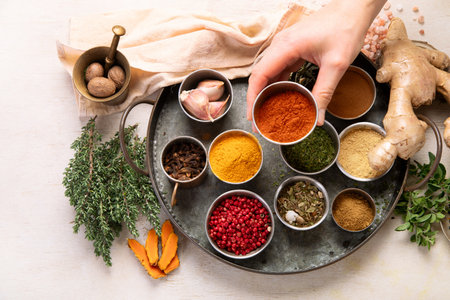 Many different spices. A collection of various spices and herbs on a light background. Top view.