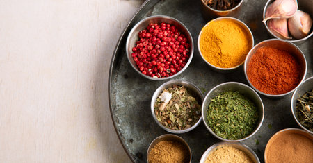 Many different spices. A collection of various spices and herbs on a light background. Top view.