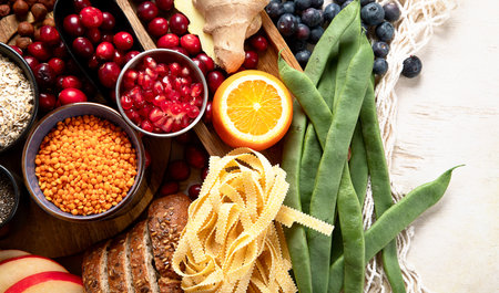 High fiber food for healthy bowel on a white background. Healthy balanced dieting concept. Top view.