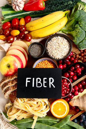 High fiber food for healthy bowel on a white background. Healthy balanced dieting concept. Top view.の写真素材