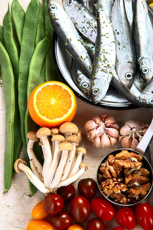 Many different healthy foods on a light background. Fresh vegetables, meat, fish, grains and fruits. Top view.の写真素材