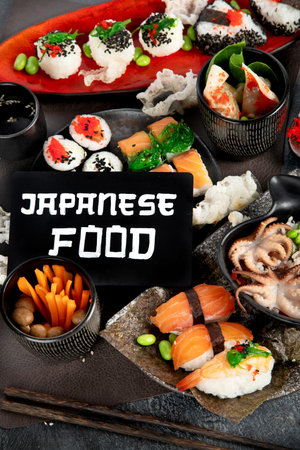 Assortment of rolls and sushi on a dark background. Top view.