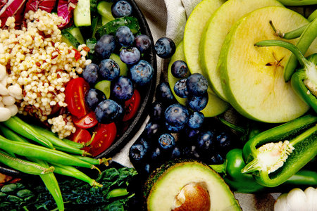 Healthy eating ingredients: fresh vegetables and fruits. Different vegan products on a light background. Top view.
