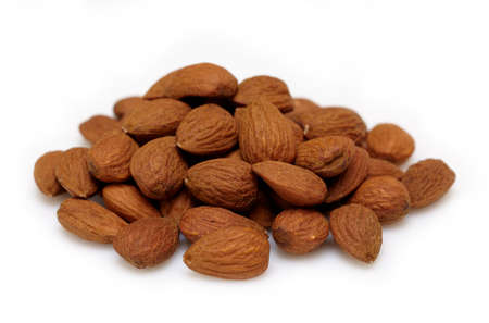 Heap of almonds on white backgroundの写真素材