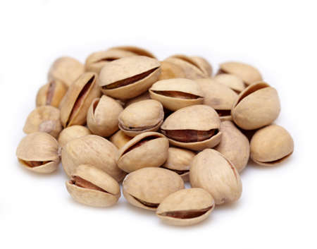 Heap of pistachios on white backgroundの写真素材