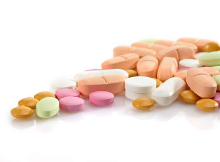 Heap of various pills on white backgroundの写真素材