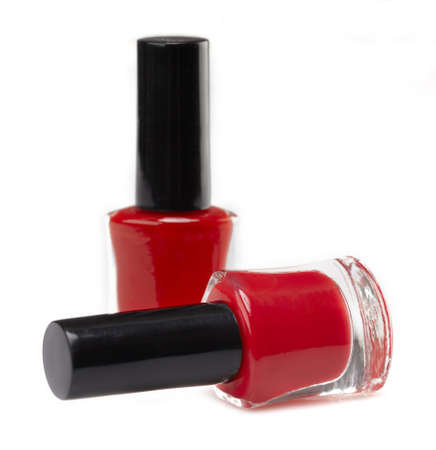 Two bottles of red nail polish on white backgroundの写真素材