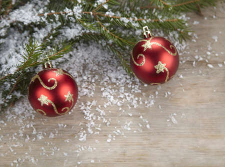 Red Christmas decorations on wooden backgroundの写真素材