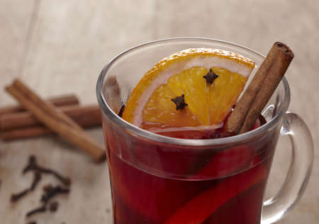 Mulled wine with slice of orange and cinnamon stickの写真素材