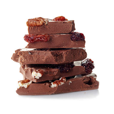 Heap of broken chocolate pieces on white backgroundの写真素材