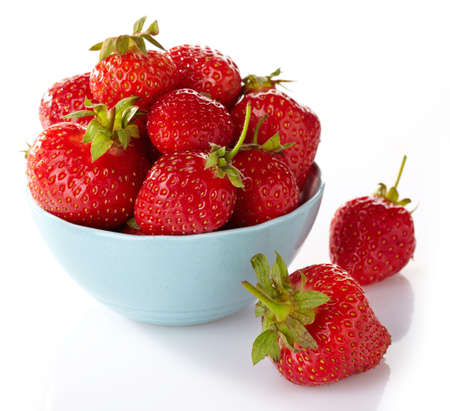 Bowl of fresh strawberries on white backgroundの写真素材
