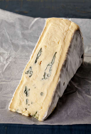 Brie cheese on white baking paperの写真素材