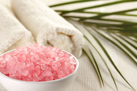 Bowl of bath salts and towelsの写真素材