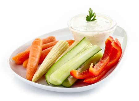 Plate of fresh vegetables and garlic dipの写真素材