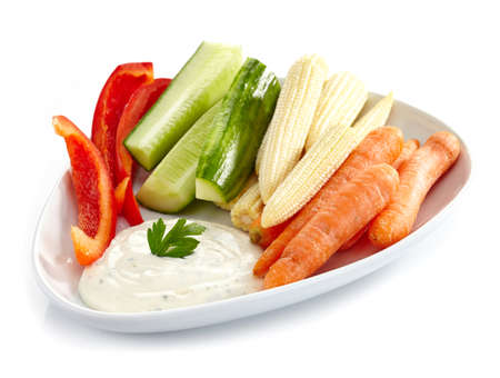 Plate of fresh vegetables and garlic dipの写真素材