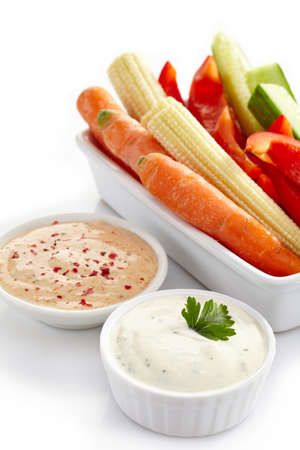 Bowl of fresh vegetables and dips