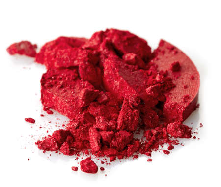 Red crushed eye shadows on white backgroundの写真素材